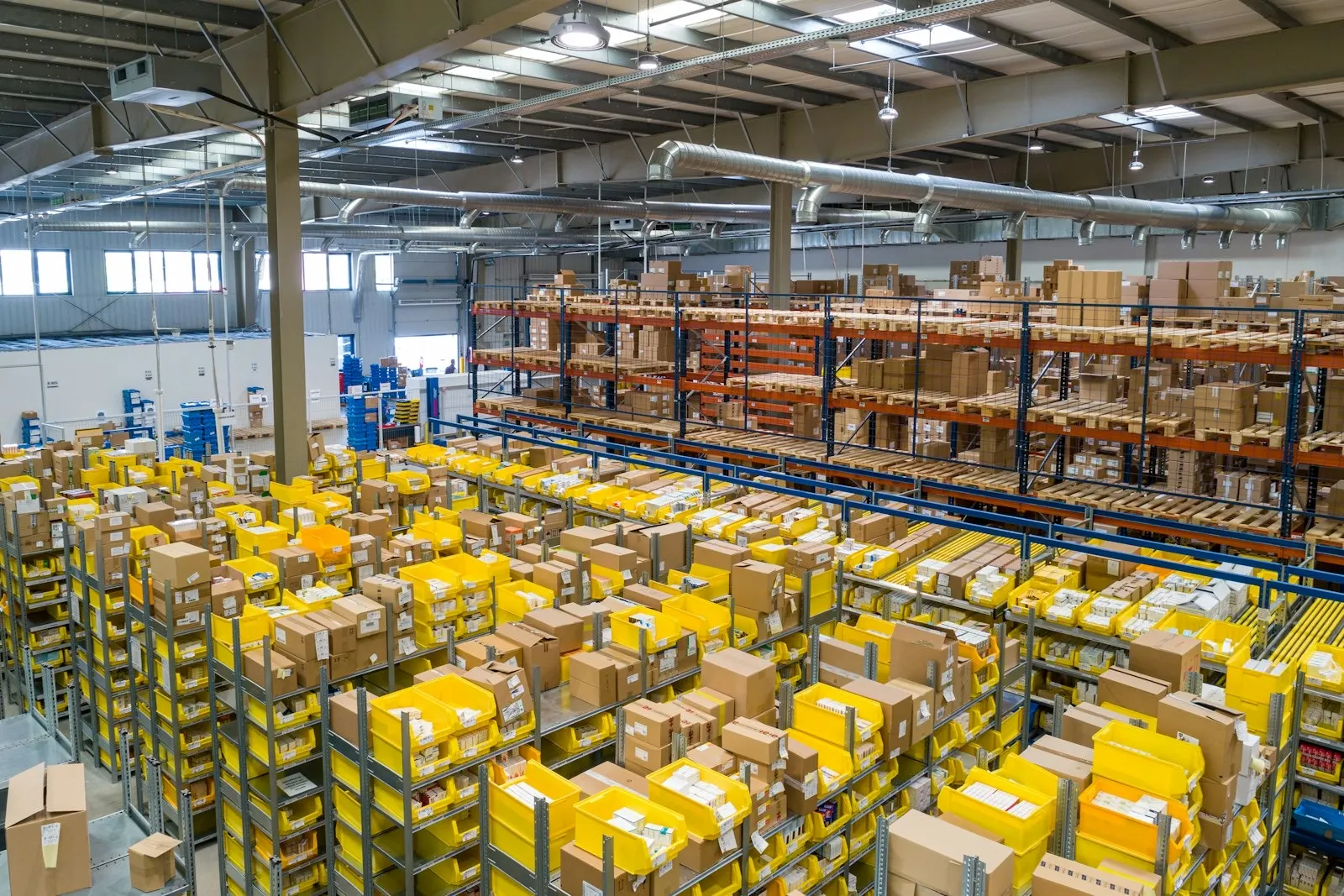 A large warehouse floor with shelving and stock